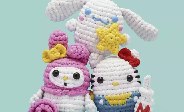 This product image released by The Woobles/The Toy Insider shows crochet craft projects featuring Sanrio’s Hello Kitty characters. (The Woobles/The Toy Insider via AP)