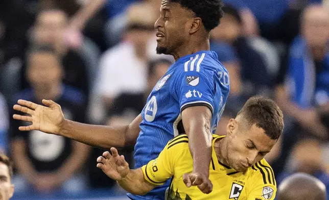 CF Montreal midfielder Rida Zouhir (18) battles against Columbus Crew defender Yevhen Cheberko (21) during the first half of an MLS soccer game, Wednesday, May 15, 2024 in Montreal.(Christinne Muschi/The Canadian Press via AP)