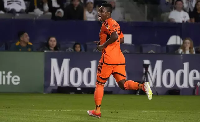 Houston Dynamo forward Latif Blessing celebrates his goal during the first half of a Major League Soccer match against the LA Galaxy on Saturday, May 25, 2024, in Carson, Calif. (AP Photo/Mark J. Terrill)