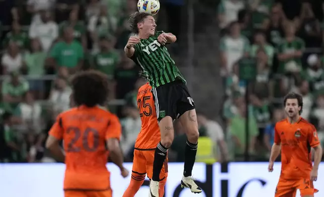 Austin FC forward CJ Fodrey (19) heads the ball over Houston Dynamo midfielder Griffin Dorsey (25) during the second half of an MLS soccer match, Wednesday, May 15, 2024, in Austin, Texas. (AP Photo/Eric Gay)