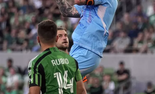Houston Dynamo goalkeeper Steve Clark (12) block a shot on goal during the first half of an MLS soccer match against Austin FC, Wednesday, May 15, 2024, in Austin, Texas. (AP Photo/Eric Gay)