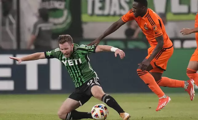 Austin FC forward Jon Gallagher (17) and Houston Dynamo forward Ibrahim Aliyu, right, chase a pass during the second half of an MLS soccer match, Wednesday, May 15, 2024, in Austin, Texas. (AP Photo/Eric Gay)