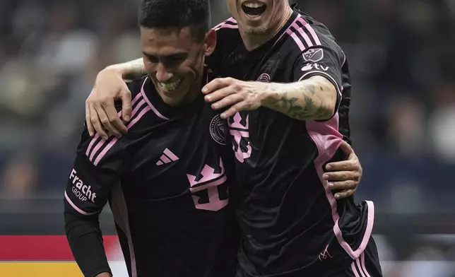 Inter Miami's Robert Taylor, right, and Matias Rojas, left, celebrate after Taylor's goal against the Vancouver Whitecaps during the first half of an MLS soccer match in Vancouver, British Columbia, Saturday, May 25, 2024. (Darryl Dyck/The Canadian Press via AP)