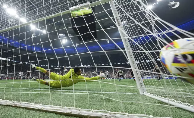 Inter Miami goalkeeper Drake Callender allows a goal to Vancouver Whitecaps' Ryan Gauld on a penalty shot during the second half of an MLS soccer match Saturday, May 25, 2024, in Vancouver, British Columbia. (Darryl Dyck/The Canadian Press via AP)