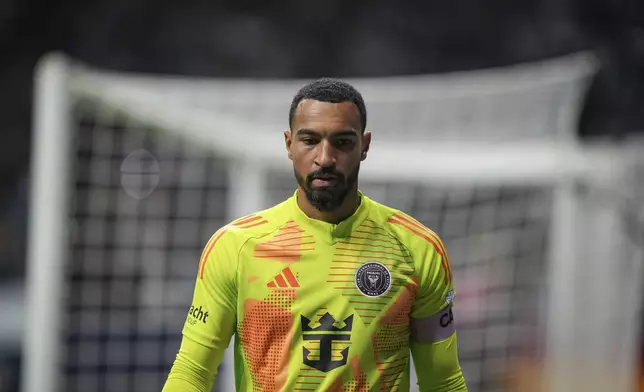 Inter Miami goalkeeper Drake Callender walks to retrieve the ball after it went out of play during the second half of the team's MLS soccer match against the Vancouver Whitecaps on Saturday, May 25, 2024, in Vancouver, British Columbia. (Darryl Dyck/The Canadian Press via AP)