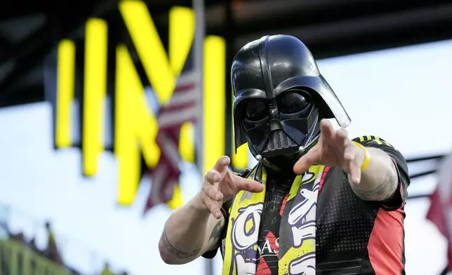 A Nashville SC fan wears a Darth Vader mask for a Star Wars Night celebration during an MLS soccer match between Nashville SC and CF Montréal, Saturday, May 4, 2024, in Nashville, Tenn. (AP Photo/George Walker IV)