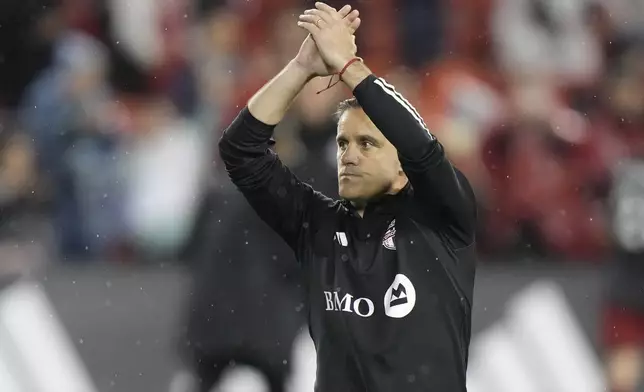 Toronto FC coach John Herdman thanks the fans after the team's MLS soccer match against New York City FC on Saturday, May 11, 2024, in Toronto. (Frank Gunn/The Canadian Press via AP)