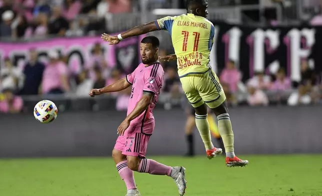 Inter Miami's Marcelo Weigandt, left, controls the ball in front of New York Red Bulls forward Elias Manoel (11) during the second half of an MLS soccer game, Saturday, May 4, 2024, in Fort Lauderdale, Fla. (AP Photo/Michael Laughlin)