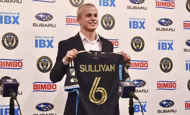 Philadelphia Union player Cavan Sullivan, 14, holds up his No. 6 jersey during an MLS soccer news conference at Subaru Park in Chester, Pa., Thursday, May 9, 2024. (Jonathan Tannenwald/The Philadelphia Inquirer via AP