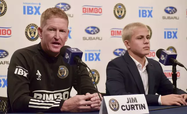 Philadelphia Union manager Jim Curtin, left, speaks alongside new player Cavan Sullivan, 14, during an MLS soccer news conference at Subaru Park in Chester, Pa., Thursday, May 9, 2024. (Jonathan Tannenwald/The Philadelphia Inquirer via AP