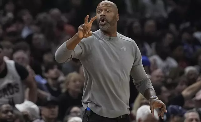 Orlando Magic head coach Jamahl Mosley gestures in the first half of Game 7 of an NBA basketball first-round playoff series against the Cleveland Cavaliers, Sunday, May 5, 2024, in Cleveland. (AP Photo/Sue Ogrocki)