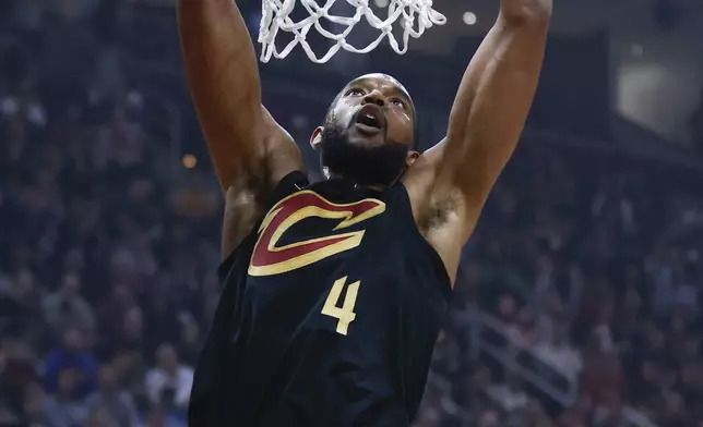 Cleveland Cavaliers forward Evan Mobley dunks against the Orlando Magic during the first half of Game 5 of an NBA basketball first-round playoff series, Tuesday, April 30, 2024, in Cleveland. (AP Photo/Ron Schwane)