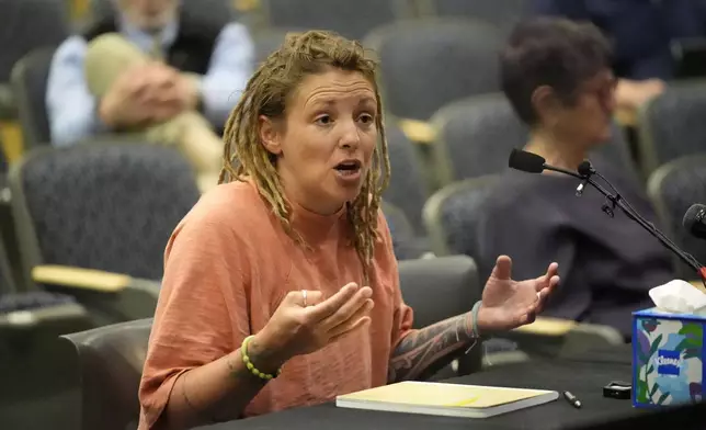 Cara Lamb, ex-wife of shooter Robert Card, testifies, Thursday, May 16, 2024, in Augusta, Maine, during a hearing of the independent commission investigating the law enforcement response to the mass shooting in Lewiston, Maine. (AP Photo/Robert F. Bukaty)