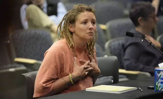 Cara Lamb, ex-wife of shooter Robert Card, testifies, Thursday, May 16, 2024, in Augusta, Maine, during a hearing of the independent commission investigating the law enforcement response to the mass shooting in Lewiston, Maine. (AP Photo/Robert F. Bukaty)