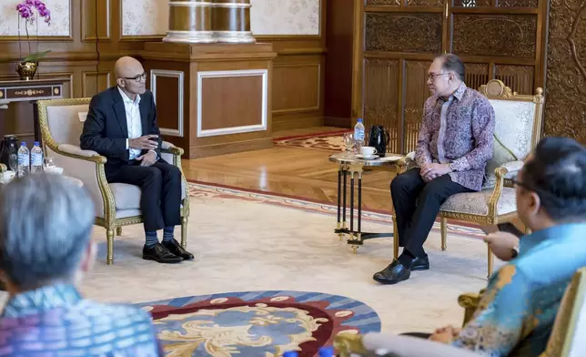 In this photo provided by Malaysia Prime Minister Office, Malaysia's Prime Minister Anwar Ibrahim, right, meets with Microsoft CEO Satya Nadella at the prime minister's office in Putrajaya, Malaysia, Thursday, May 2, 2024. (Albarra Azfar/Prime Minister's Office of Malaysia via AP)