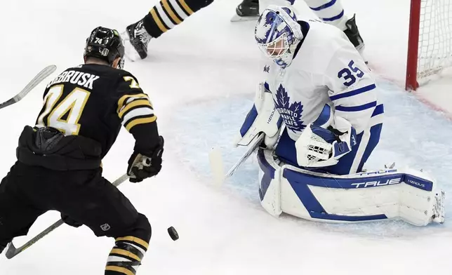 Boston Bruins' Jake DeBrusk (74) looks to get a shot on Toronto Maple Leafs' Ilya Samsonov (35) during the first period of Game 7 of an NHL hockey Stanley Cup first-round playoff series, Saturday, May 4, 2024, in Boston. (AP Photo/Michael Dwyer)