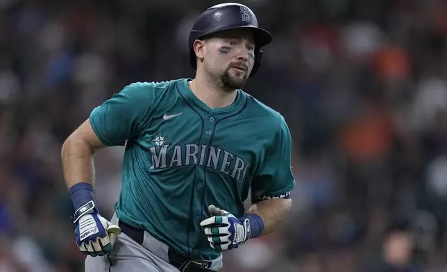 Seattle Mariners' Cal Raleigh runs the bases after hitting a go-ahead solo home run during the ninth inning of a baseball game against the Houston Astros, Sunday, May 5, 2024, in Houston. (AP Photo/Kevin M. Cox)