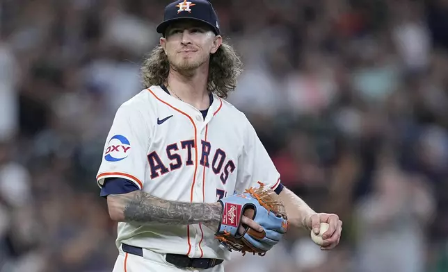 Houston Astros relief pitcher Josh Hader walks near the mound as Seattle Mariners' Cal Raleigh runs the bases after hitting a go-ahead solo home run during the ninth inning of a baseball game, Sunday, May 5, 2024, in Houston. (AP Photo/Kevin M. Cox)