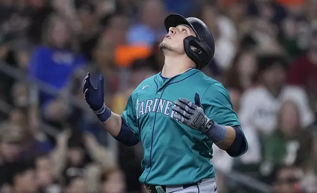 Seattle Mariners' Luis Urías celebrates after hitting a solo home run during the fifth inning of a baseball game against the Houston Astros Saturday, May 4, 2024, in Houston. (AP Photo/Kevin M. Cox)