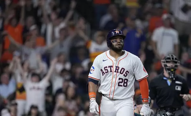 Houston Astros' Jon Singleton watchers his go-ahead two-run home run during the seventh inning of a baseball game against the Seattle Mariners, Sunday, May 5, 2024, in Houston. (AP Photo/Kevin M. Cox)