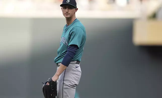 Seattle Mariners starting pitcher George Kirby stands on the mound after a solo home run by Minnesota Twins' Trevor Larnach during the first inning of a baseball game Wednesday, May 8, 2024, in Minneapolis. (AP Photo/Abbie Parr)