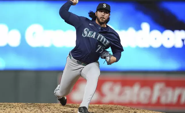 Seattle Mariners relief pitcher Andrés Muñoz (75) delivers during the ninth inning of a baseball game against the Minnesota Twins, Tuesday, May 7, 2024, in Minneapolis. (AP Photo/Abbie Parr)