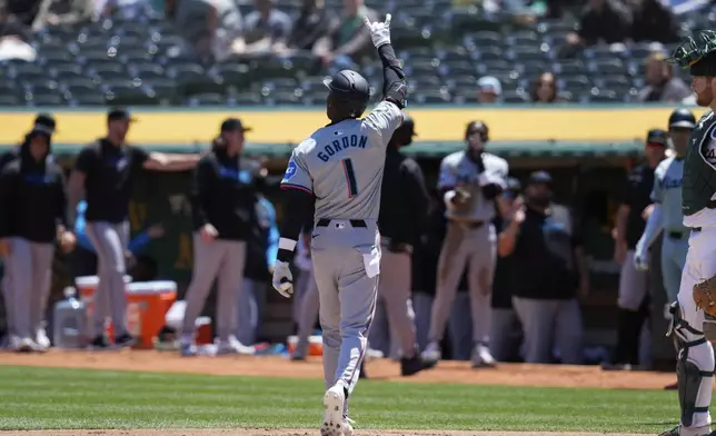 Miami Marlins' Nick Gordon (1) celebrates after hitting a three-run home run against Oakland Athletics pitcher Joe Boyle during the first inning of a baseball game, Sunday, May 5, 2024, in Oakland, Calif. (AP Photo/Godofredo A. Vásquez)