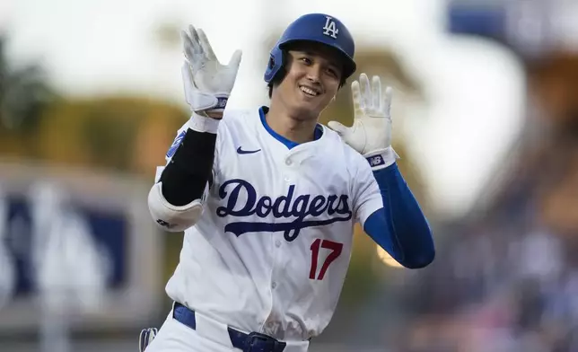 Los Angeles Dodgers two-way player Shohei Ohtani runs the bases after hitting a home run during the first inning of a baseball game against the Miami Marlins in Los Angeles, Monday, May 6, 2024. Mookie Betts also scored. (AP Photo/Ashley Landis)