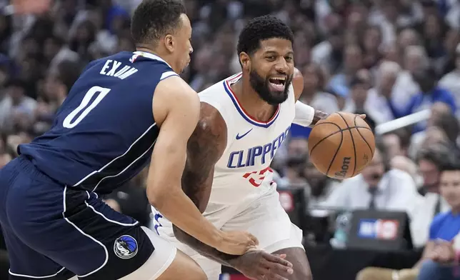 Los Angeles Clippers forward Paul George, right, tries to drive by Dallas Mavericks guard Dante Exum during the first half in Game 5 of an NBA basketball first-round playoff series Wednesday, May 1, 2024, in Los Angeles. (AP Photo/Mark J. Terrill)