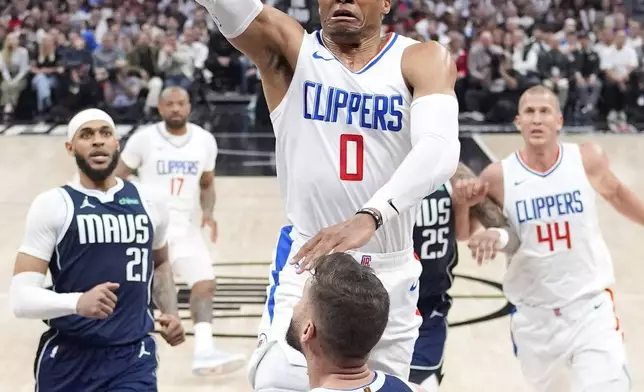 Los Angeles Clippers guard Russell Westbrook (0) shoots as Dallas Mavericks forward Maxi Kleber (42) defends during the second half in Game 5 of an NBA basketball first-round playoff series Wednesday, May 1, 2024, in Los Angeles. (AP Photo/Mark J. Terrill)