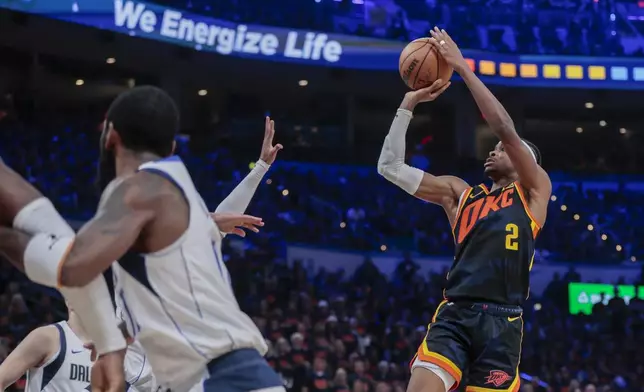 Oklahoma City Thunder guard Shai Gilgeous-Alexander (2) shoots against the Dallas Mavericks during the second half of Game 5 of an NBA basketball second-round playoff series, Wednesday, May 15, 2024, in Oklahoma City. (AP Photo/Nate Billings)