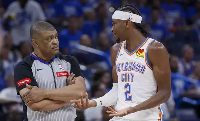 Oklahoma City Thunder guard Shai Gilgeous-Alexander (2) talks with official Tony Brothers during the second half of Game 1 of an NBA basketball second-round playoff series against the Dallas Mavericks, Tuesday, May 7, 2024, in Oklahoma City. (AP Photo/Nate Billings)