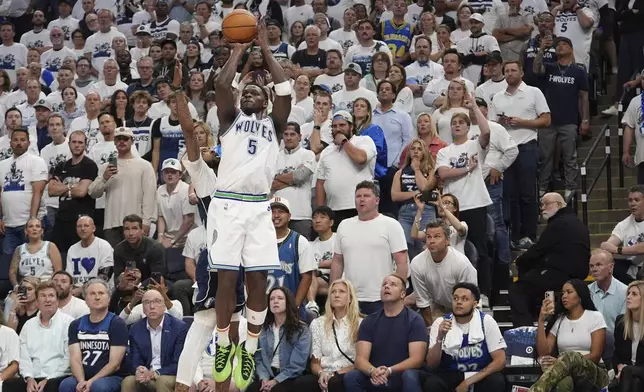 Minnesota Timberwolves guard Anthony Edwards (5) shoots against the Dallas Mavericks during the second half in Game 1 of the NBA basketball Western Conference finals, Wednesday, May 22, 2024, in Minneapolis. (AP Photo/Abbie Parr)