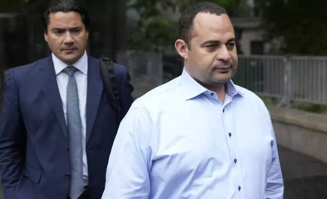 FILE - Wael Hana, right, leaves the federal courthouse in New York, Tuesday, Sept. 26, 2023. For the second time in a decade, Sen. Bob Menendez, D-N.J., faces a corruption trial Monday, May 13, 2024, with his political career and freedom on the line. Hana is accused of paying off Menendez for helping him get a lucrative deal with the Egyptian government to certify that imported meat met Islamic dietary requirements. (AP Photo/Seth Wenig, File)