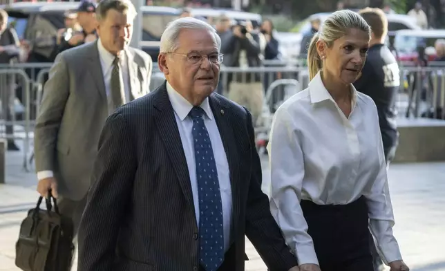 FILE - Democratic U.S. Sen. Bob Menendez of New Jersey, left, and his wife Nadine Menendez arrive at the federal courthouse in New York, Sept. 27, 2023. For the second time in a decade, Menendez is finding his career and life on the line in a federal criminal case. The New Jersey Democrat goes to trial on Monday, May 13, 2024, in Manhattan federal court. Menendez and his wife are accused of accepting bribes from three wealthy businessmen in his home state and performing a variety of favors in return. (AP Photo/Jeenah Moon, File)