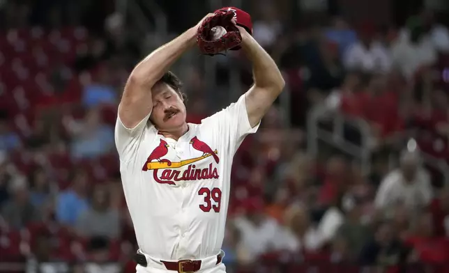 St. Louis Cardinals starting pitcher Miles Mikolas pauses on the mound after giving up a three-run home run to New York Mets' Brandon Nimmo during the fifth inning of a baseball game Tuesday, May 7, 2024, in St. Louis. (AP Photo/Jeff Roberson)
