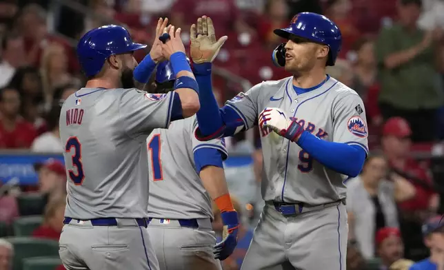 New York Mets' Brandon Nimmo (9) is congratulated by teammate Tomas Nido (3) after hitting a three-run home run during the fifth inning of a baseball game against the St. Louis Cardinals Tuesday, May 7, 2024, in St. Louis. (AP Photo/Jeff Roberson)