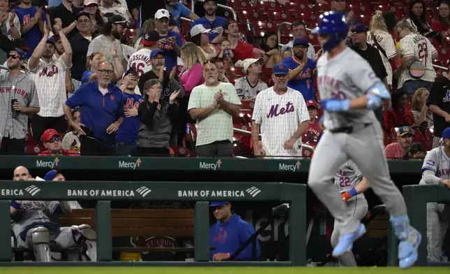 Mets fans applaud as New York Mets' Pete Alonso rounds the bases after hitting a solo home run during the ninth inning of a baseball game against the St. Louis Cardinals Tuesday, May 7, 2024, in St. Louis. (AP Photo/Jeff Roberson)