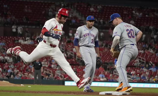 St. Louis Cardinals' Brendan Donovan, left, grounds out to New York Mets first baseman Pete Alonso (20) as Mets relief pitcher Edwin Diaz watches during the ninth inning of a baseball game Monday, May 6, 2024, in St. Louis. (AP Photo/Jeff Roberson)