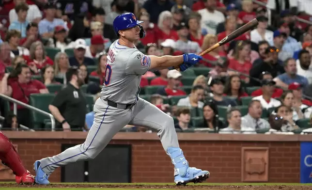 New York Mets' Pete Alonso follows through on a two-run double during the fifth inning of a baseball game against the St. Louis Cardinals Tuesday, May 7, 2024, in St. Louis. (AP Photo/Jeff Roberson)