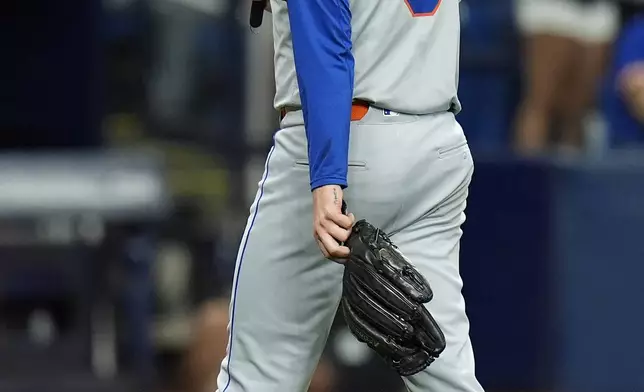 New York Mets relief pitcher Adam Ottavino walks off after being taken out the game against the Tampa Bay Rays during the eighth inning of a baseball game Saturday, May 4, 2024, in St. Petersburg, Fla. (AP Photo/Chris O'Meara)