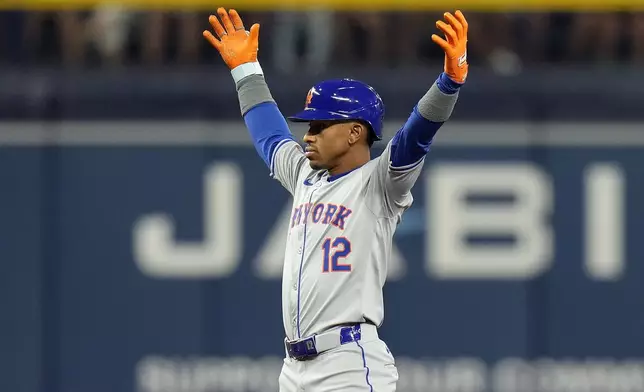 New York Mets' Francisco Lindor (12) reacts after his two-run double off Tampa Bay Rays starting pitcher Aaron Civale during the fifth inning of a baseball game Friday, May 3, 2024, in St. Petersburg, Fla. (AP Photo/Chris O'Meara)