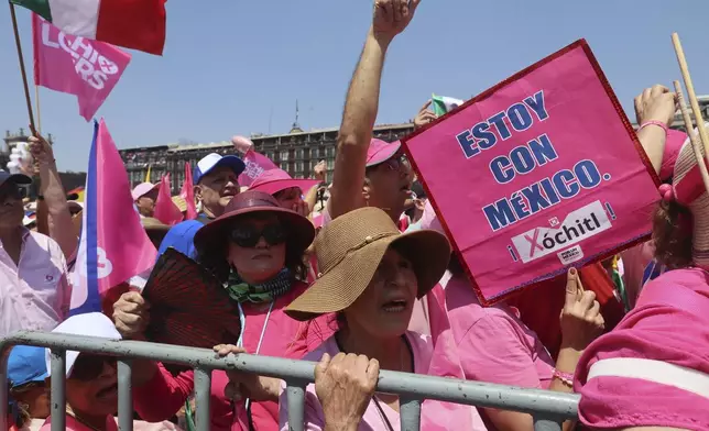 People participate in an opposition rally ahead of the June 2 presidential elections, at the Zocalo, Mexico City's main square, Sunday, May 19, 2024. (AP Photo/Ginnette Riquelme)