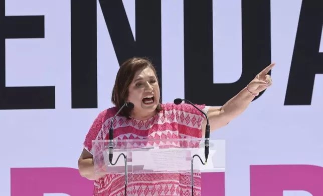 Mexican presidential candidate Xochitl Galvez speaks at an opposition rally to encourage voting ahead of the June 2 presidential elections, in the Zocalo, Mexico City, Sunday, May 19, 2024. (AP Photo/Ginnette Riquelme)