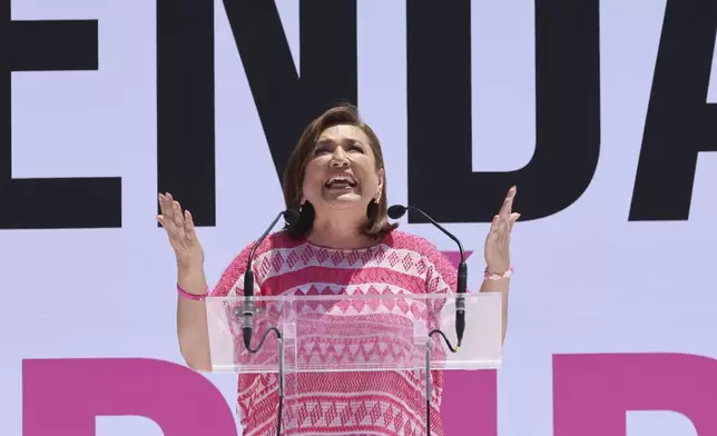 Mexican presidential candidate Xochitl Galvez speaks at an opposition rally to encourage voting ahead of the June 2 presidential elections, in the main square, Mexico City, Sunday, May 19, 2024. (AP Photo/Ginnette Riquelme)