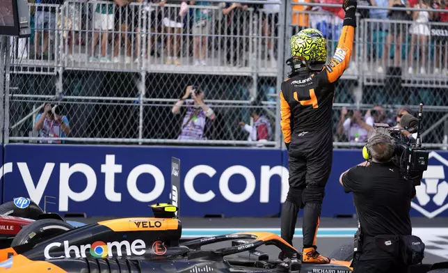 McLaren driver Lando Norris, of Britain, waves to the crowd after winning the Miami Formula One Grand Prix auto race Sunday, May 5, 2024, in Miami Gardens, Fla. (AP Photo/Rebecca Blackwell)