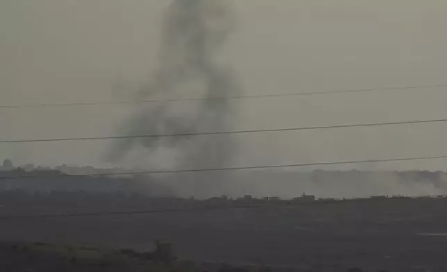 This frame grab taken from video shot in southern Israel shows smoke rising from what Palestinian medics say is an Israeli airstrike in Gaza, Sunday, May 26, 2024. (AP Photo/Josphat Kasire)