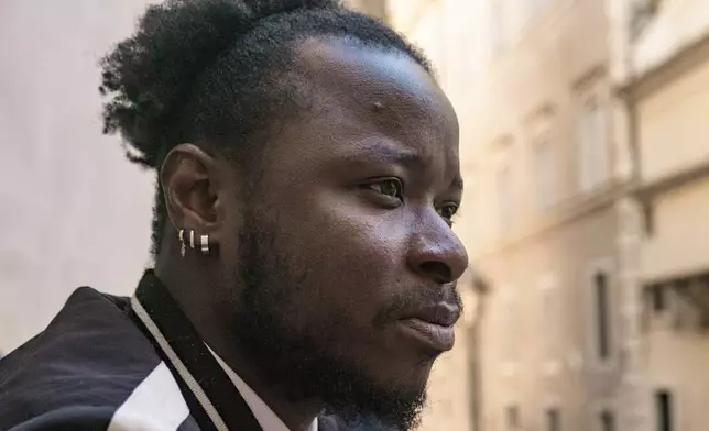 Djibril Sylla, brother of the late Ousmane Sylla, sits for an interview in Rome, Wednesday, March 20, 2024. “He told me he was in danger and that he was surrounded by really bad people and that they wanted to hurt him.” Djibril last heard from his brother on Sept. 27, 2023. (AP Photo/Paolo Santalucia)