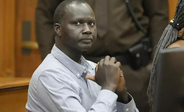 Bul Mabil, brother of Dau Mabil, a 33-year-old Jackson, Miss., resident who went missing on March 25 and whose body was found in April floating in the Pearl River in Lawrence County, waits for questioning to resume during a hearing, Tuesday, April 30, 2024 in Jackson, Miss. The hearing is on whether a judge should dissolve or modify his injunction preventing the release of Mabil's remains until an independent autopsy could be conducted. (AP Photo/Rogelio V. Solis)