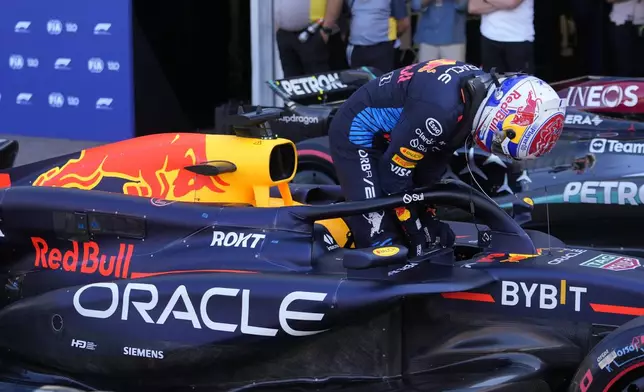 Red Bull driver Max Verstappen of the Netherlands exits his car after the qualifying session ahead of the Formula One Monaco Grand Prix at the Monaco racetrack, in Monaco, Saturday, May 25, 2024. (AP Photo/Luca Bruno)